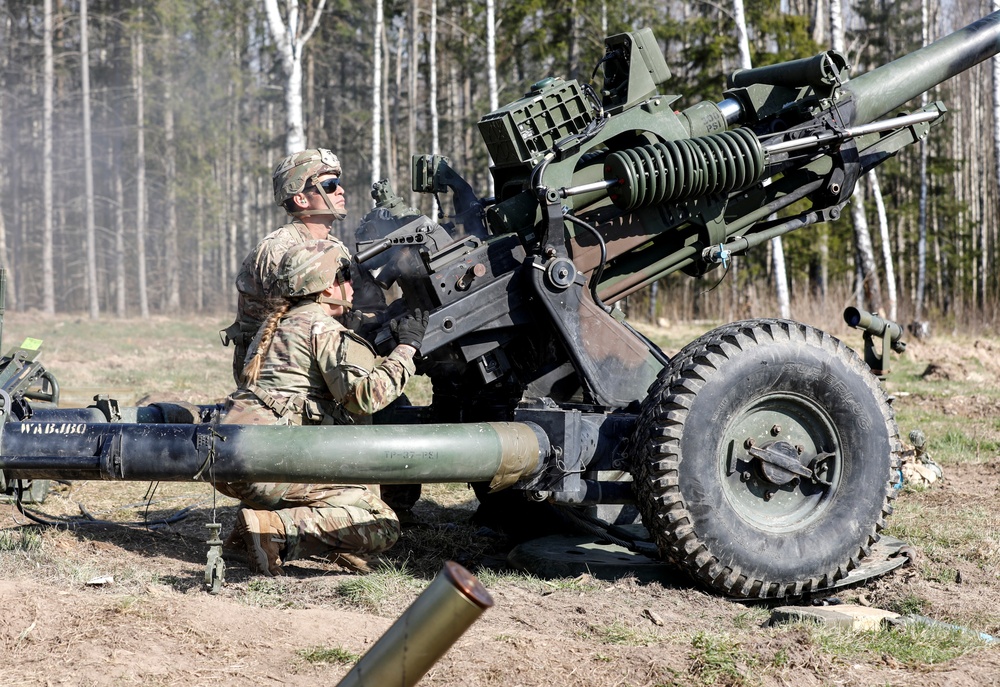 Soldier readies to fire again after tossing empty shell