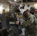 Master Sgt. Clinton McMarlin inspects soldier's gear before jump