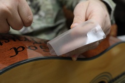 Nonprofit gives free guitars to deployed troops