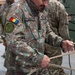 U.S. Air Force Special Operations Forces train with Romanian DCSL on knots and ropes.