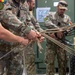 U.S. Air Force Special Operations Forces train with Romanian DCSL on knots and ropes.