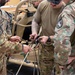 U.S. Air Force Special Operations Forces train with Romanian DCSL on knots and ropes.