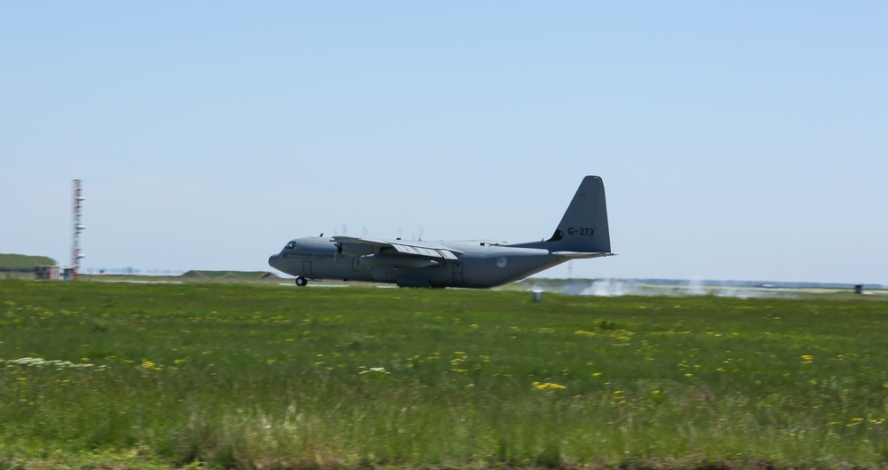 C-130 landing on the runway during Swift Response 21