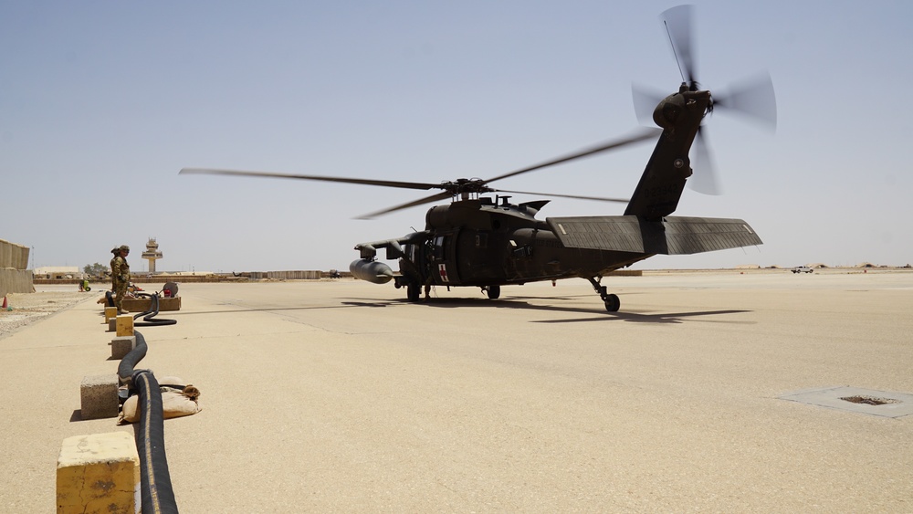 Task Force Phoenix MEDEVAC helicopters fuel up during MEDEVAC mission