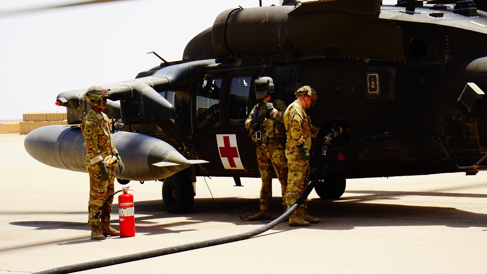 Task Force Phoenix MEDEVAC helicopters fuel up during MEDEVAC mission