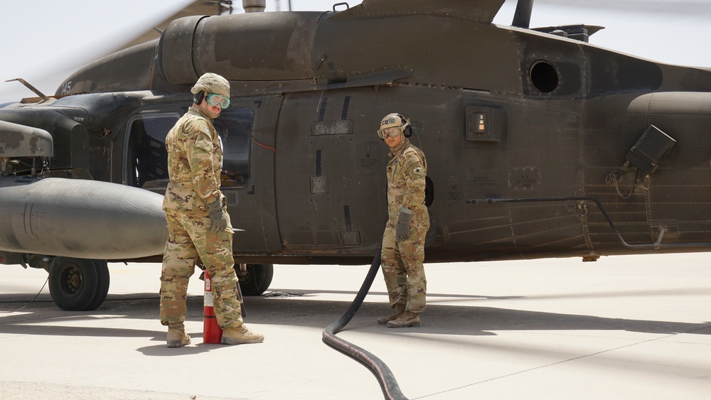 Task Force Phoenix MEDEVAC helicopters fuel up during MEDEVAC mission