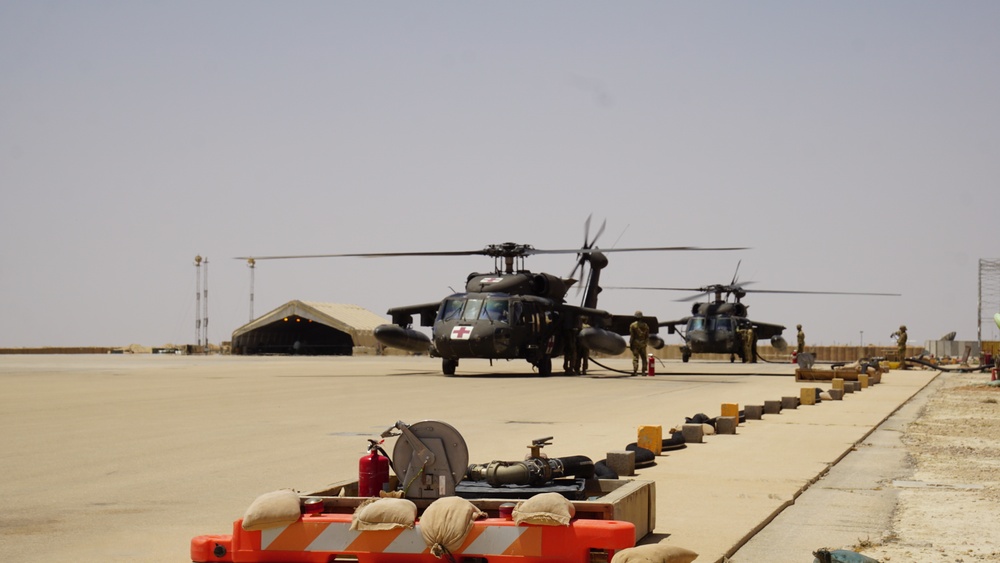 Task Force Phoenix MEDEVAC helicopters fuel up during MEDEVAC mission