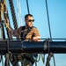 USS Constitution Sailors climb the mizzen top yard