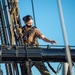 USS Constitution Sailors climb the mizzen top yard