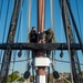 USS Constitution Sailors climb the mizzen top yard