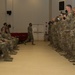 U.S. Army Signal Soldiers, 36th Infantry Division, Task Force Spartan, stand ready to receive The Bronze Order of Mercury