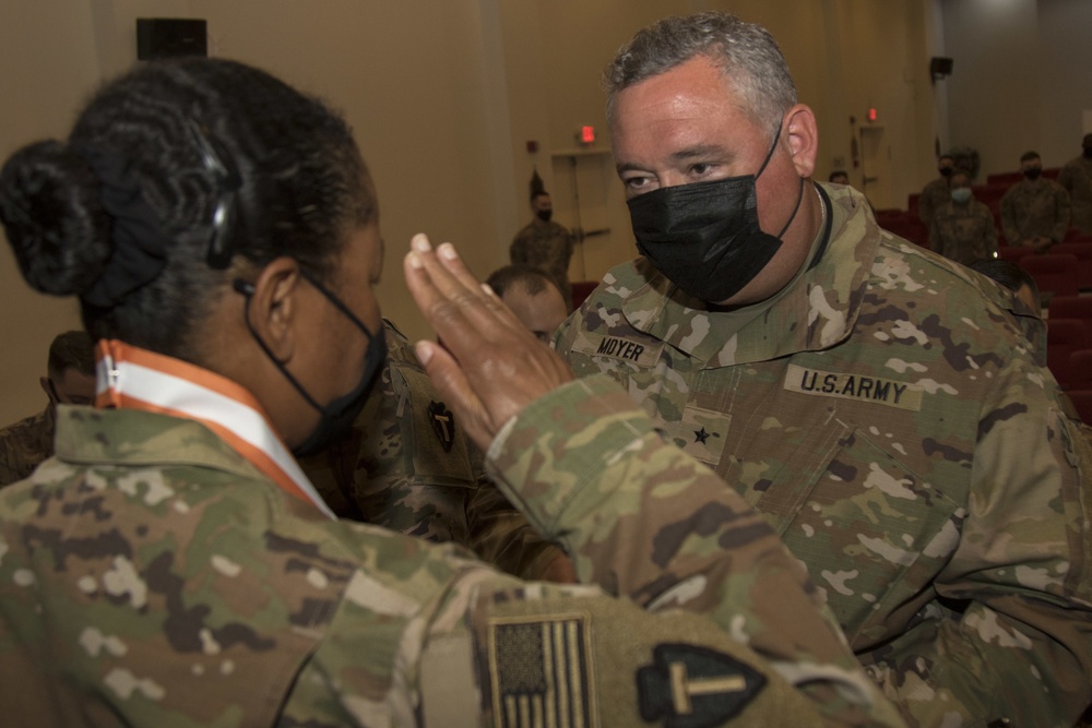 U.S. Army Sgt. 1st Class Nicole Perkins, a Signal Soldier from Task Force Spartan, receives Bronze Order of Mercury medal