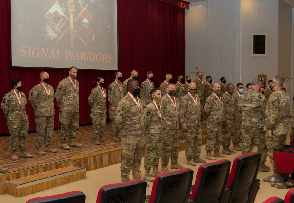 U.S. Army Signal Soldiers, 36th Infantry Division, Task Force Spartan, receive The Bronze Order of Mercury in front of honored guests