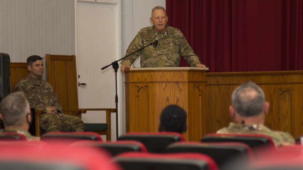 Maj. Gen. Patrick Hamilton, commanding general of 36th Infantry Division, Task Force Spartan, speaks to the awardees of The Bronze Order of Mercury