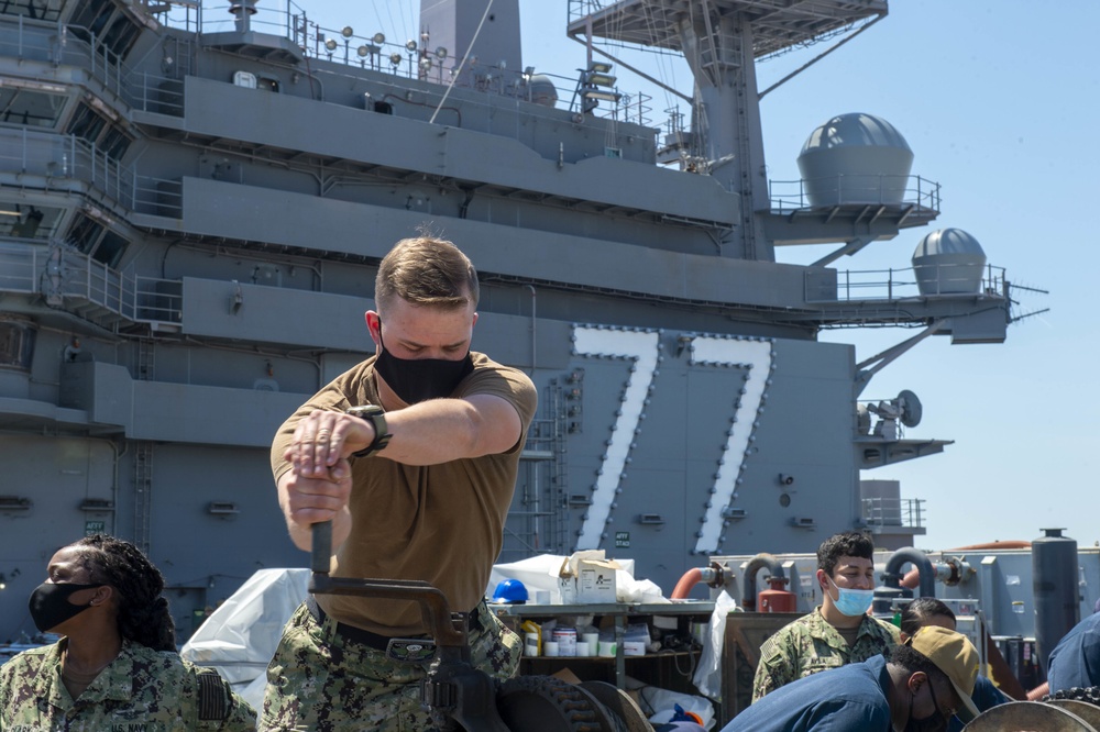 Sailors Conduct Catapult Maintenance