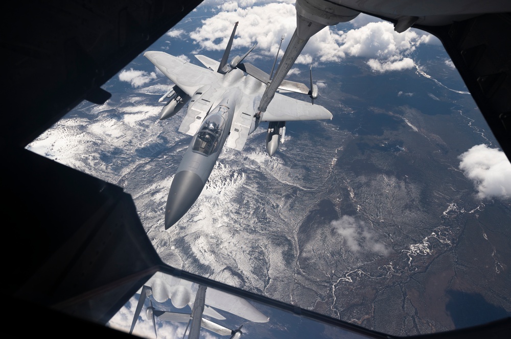 Eagles and Raptors Refuel Over Alaska