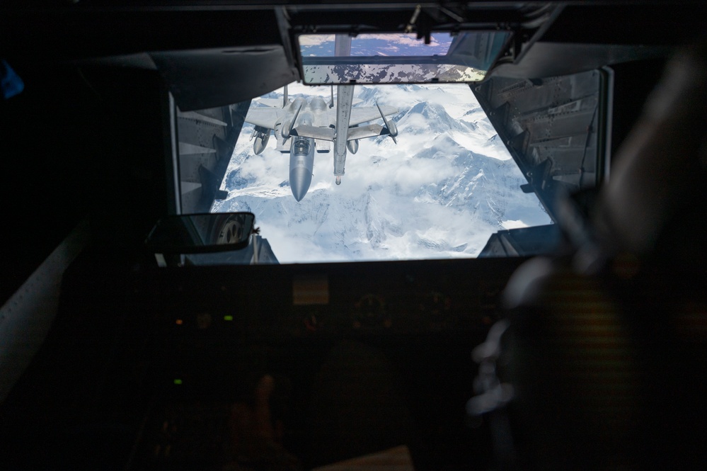 Eagles and Raptors Refuel Over Alaska