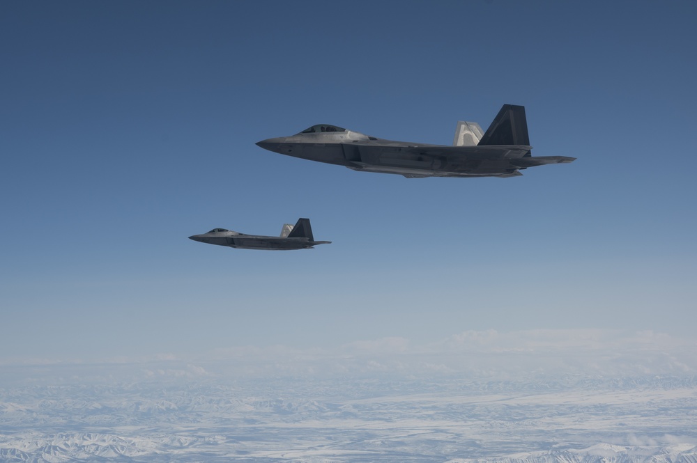 Eagles and Raptors Refuel Over Alaska