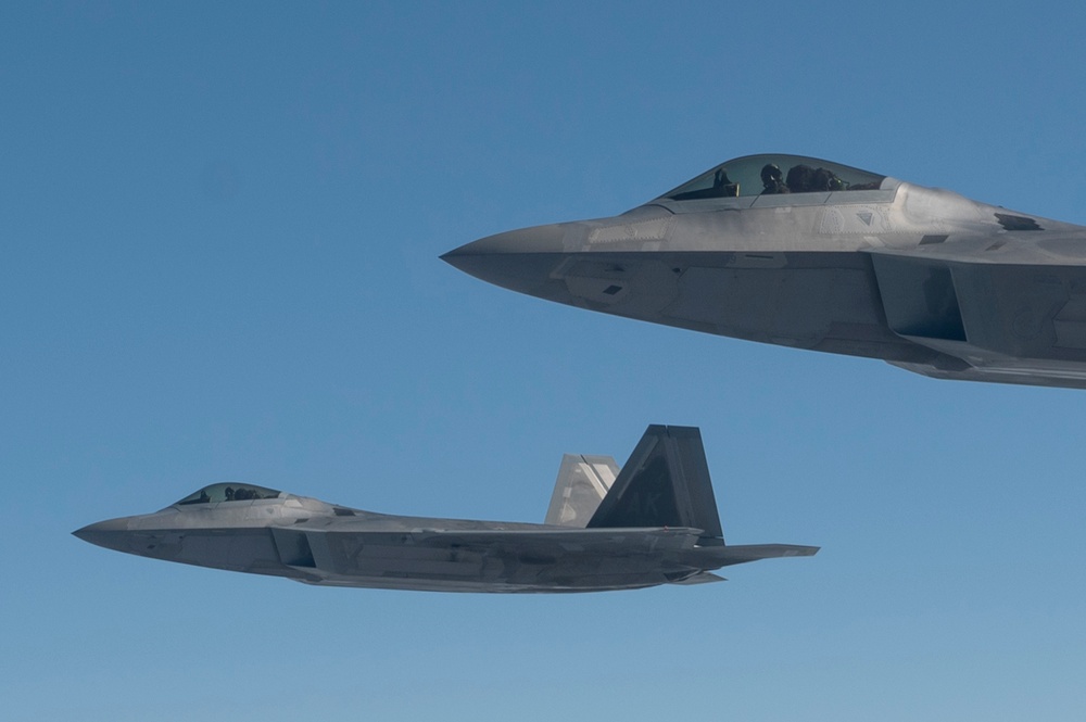 Eagles and Raptors Refuel Over Alaska