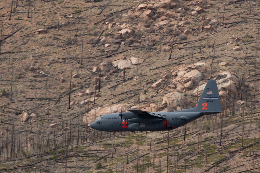 302nd Airlift Wing C-130 flies over Hayman fire scar