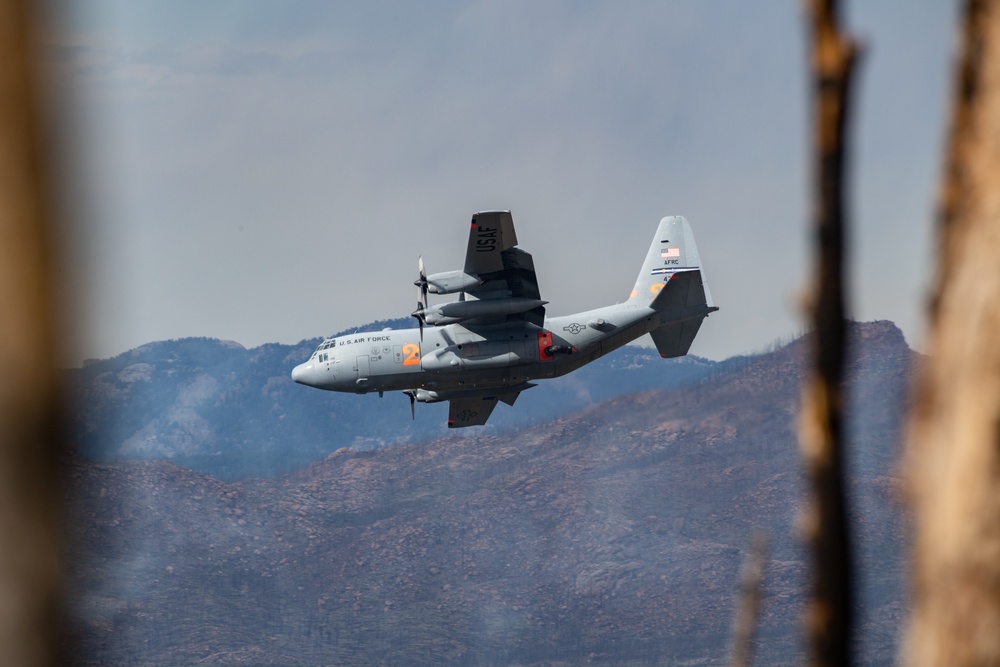 302nd Airlift C-130 banks over Hayman fire scar