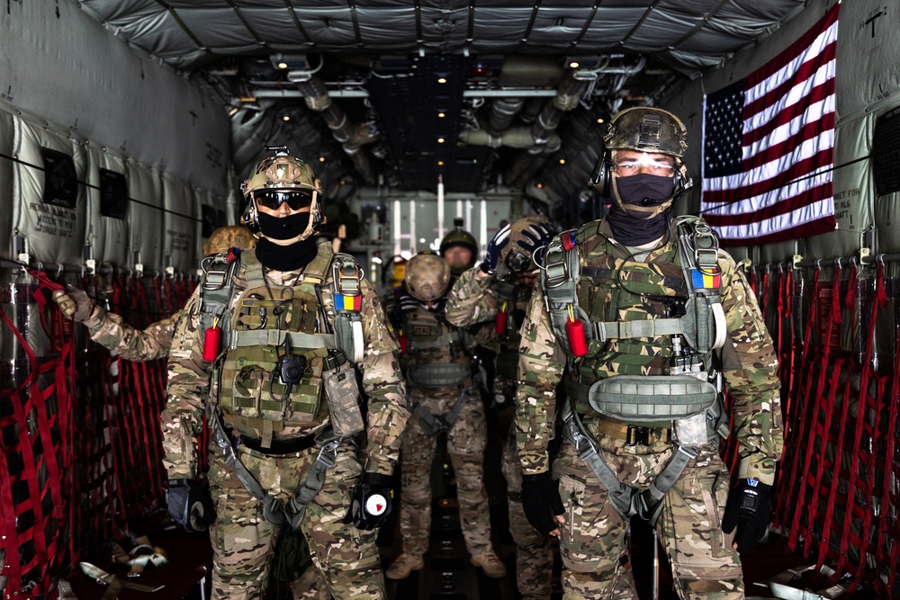 U.S. Navy SEALS conduct free fall with Romanian Special Warfare Operators