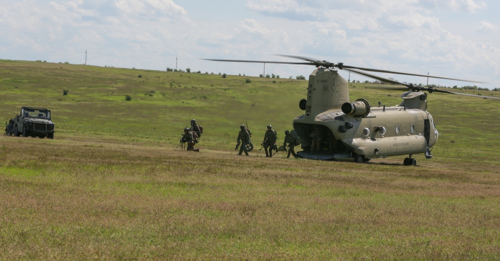 Soldiers exit CH-47 Chinook Helicopter