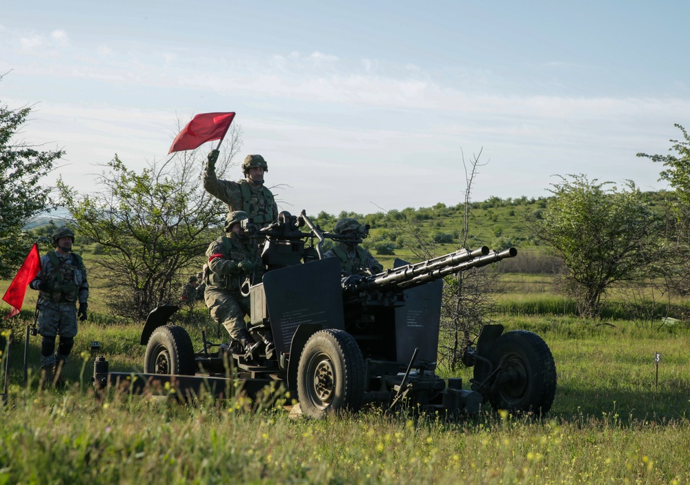 Soldiers engage with anti-aircraft canon