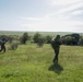 Soldiers maneuver to search a vehicle