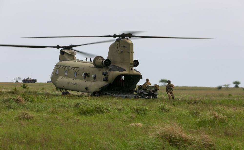 Soldier drives vehicle onto CH-47