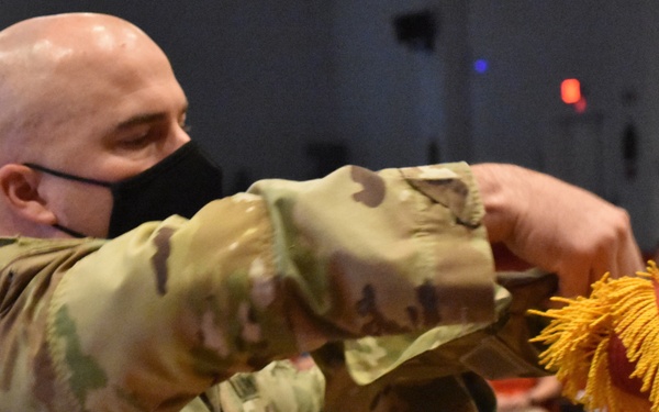 Afghanistan District cases its colors for the final time