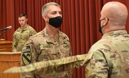 Afghanistan District cases its colors for the final time