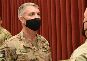 Afghanistan District cases its colors for the final time