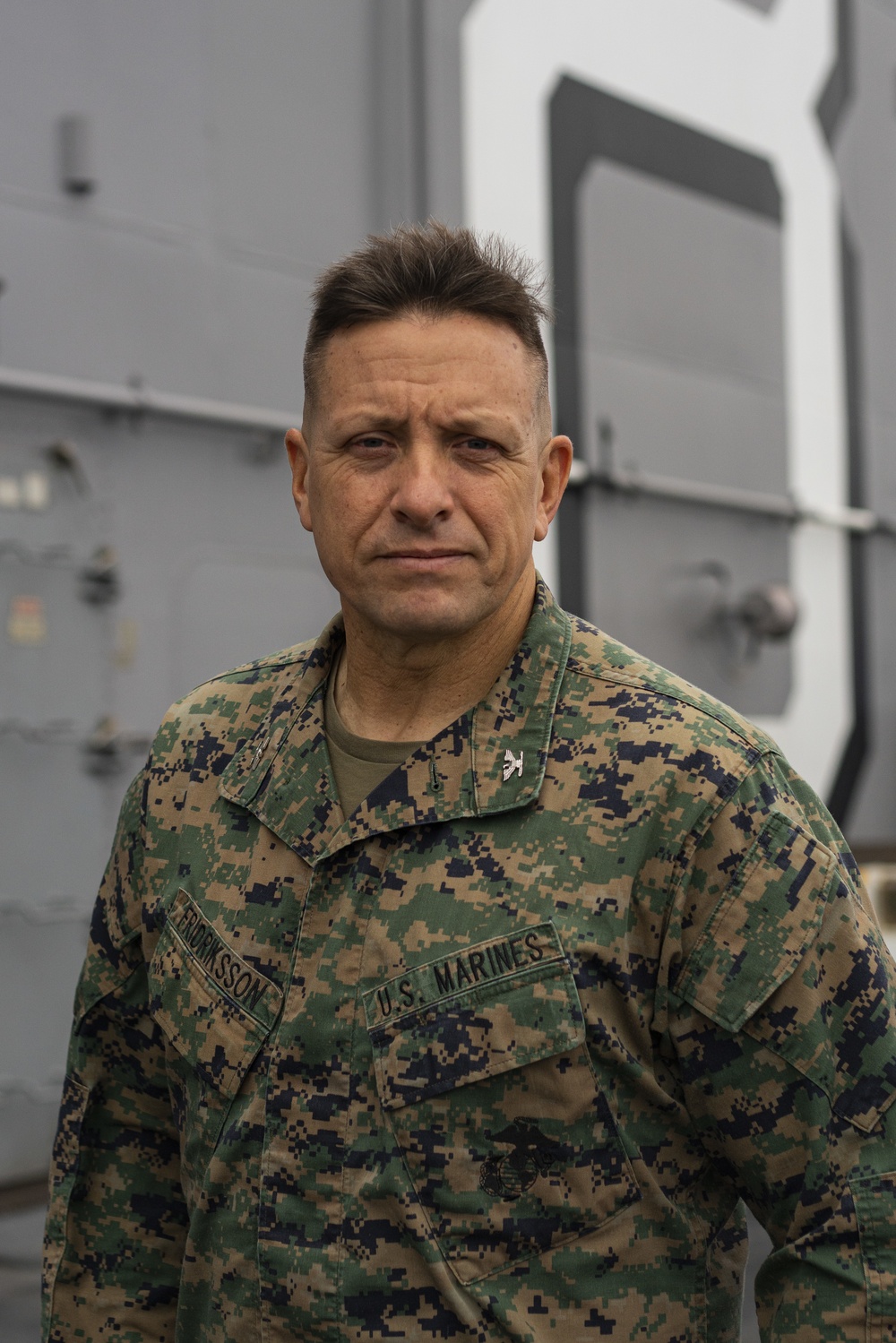 The 15th Marine Expeditionary Unit Commanding Officer Poses for a Picture