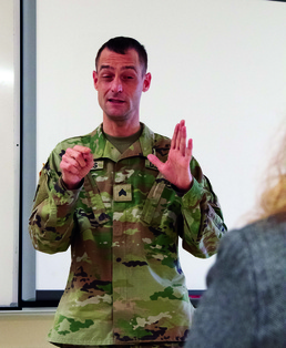 Michigan National Guard Soldier uses sign language at vaccination events