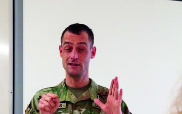 Michigan National Guard Soldier uses sign language at vaccination events
