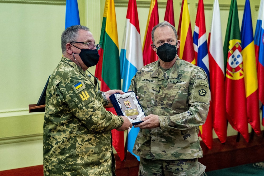 Lt. Gen. John S. Kolasheski, V Corps Commanding General, receives a plaque bestowed by Ukrainian Lt. Gen. Pavlo Tkachuk, the Chief of the Armed Forces Ukraine National Army Academy, May 14, 2021