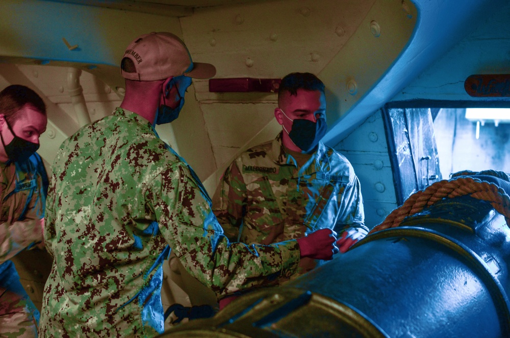 Members of the 826 MI BN loading a canon