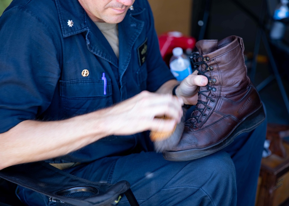 Commanding Officer of USS Sioux City Helps Shine Sailors’ Boots