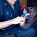 Commanding Officer of USS Sioux City Helps Shine Sailors’ Boots