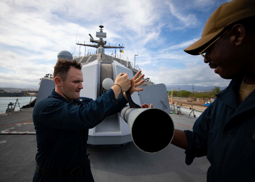 USS Sioux City Sailors Conduct Maintenance on 57mm MK 110 Gun