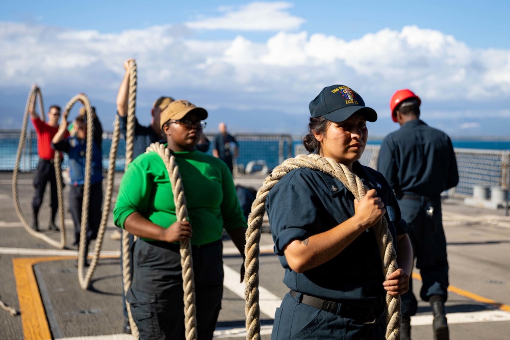 USS Sioux City Sailors Stow Lines After Departing Ponce, Puerto Rico