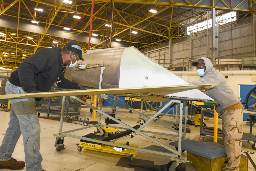 FRCSE aircraft mechanics rig horizontal stabilizer of F-5 Tiger II