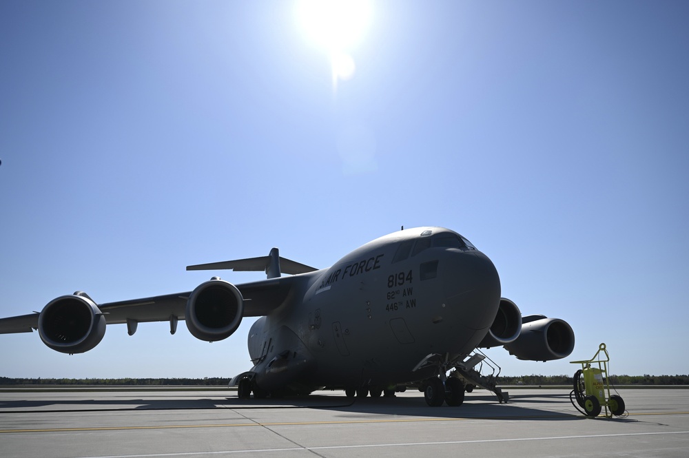 Mobility Guardian 21: 701st AS, 1-182nd FA Regiment load HIMARS onto Globemaster III