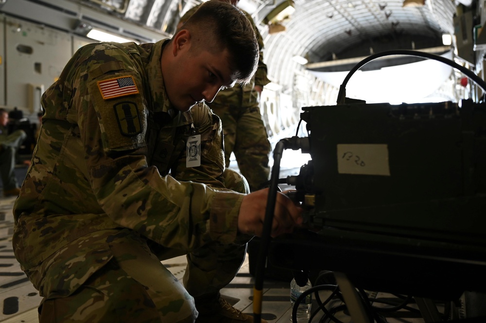 Mobility Guardian 21: 701st AS, 1-182nd FA Regiment load HIMARS onto Globemaster III