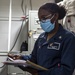 Corpsman Working Aboard USS Carl Vinson (CVN 70)