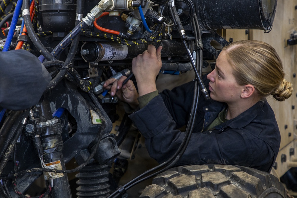 2nd Maintenance Battalion Marines work on vehicles