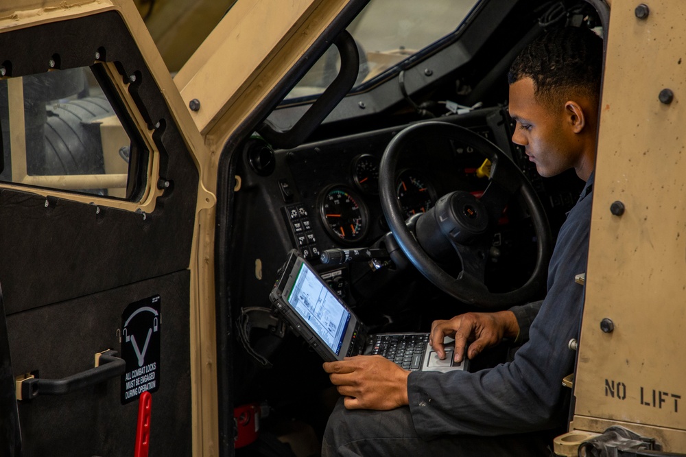 2nd Maintenance Battalion Marines work on vehicles