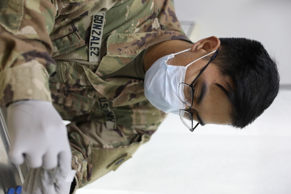 Soldiers of Task Force Phoenix receive their vaccine shots at Camp Buehring, Kuwait