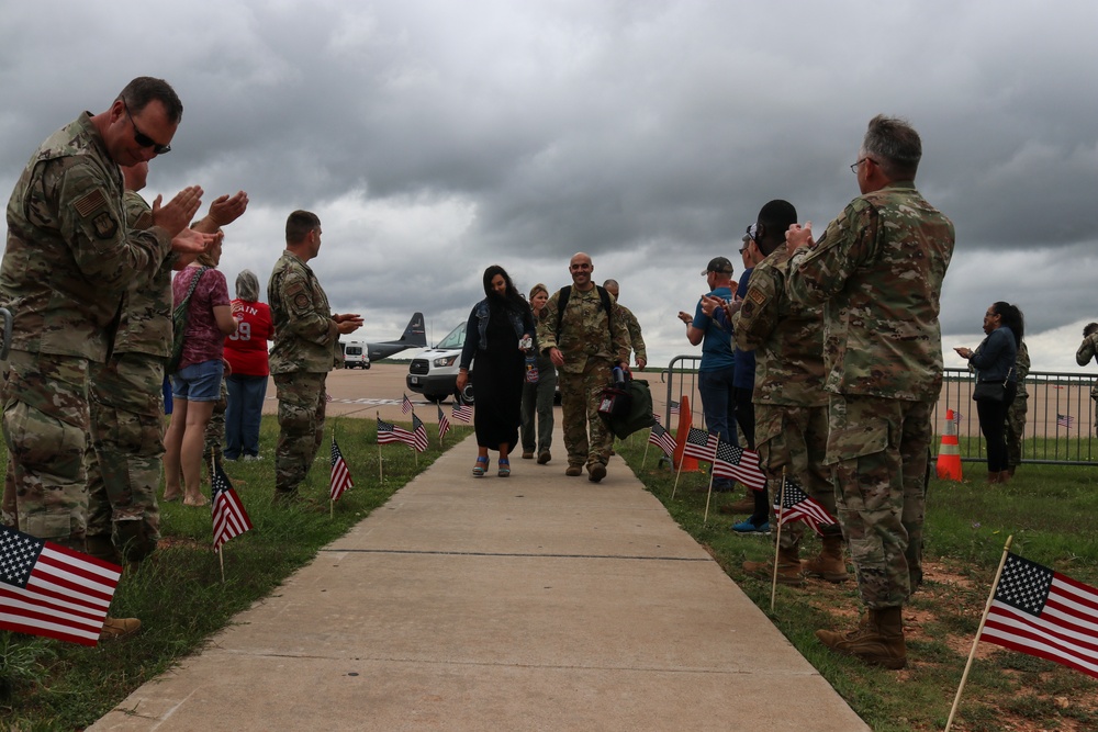 Families and Airmen welcome home 317th Airlift Wing members